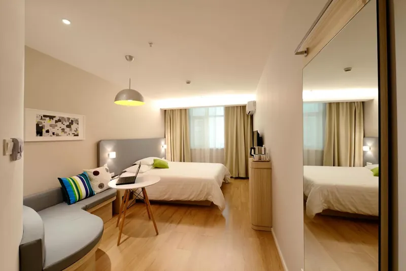 Tidy modern bedroom after one-time professional cleaning service
