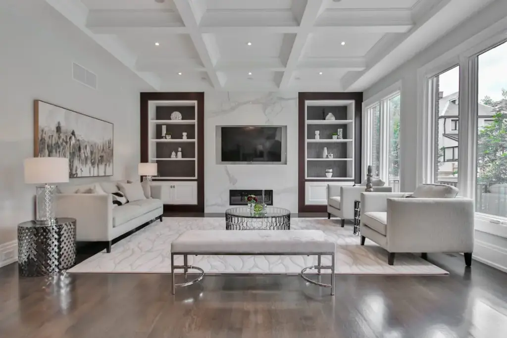 Elegant modern living room with sofa, chairs, and TV