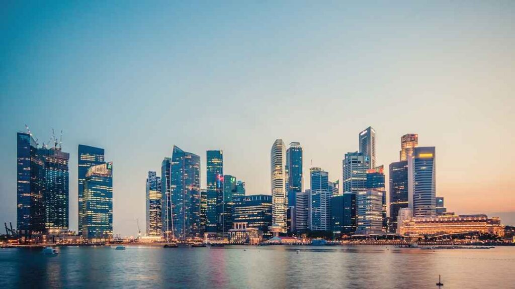 Singapore city skyline at sunset with modern skyscrapers