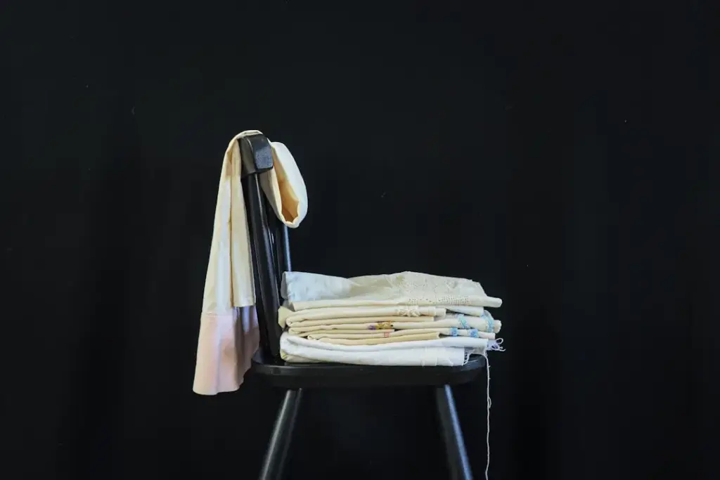 Folded clothes on chair after ironing