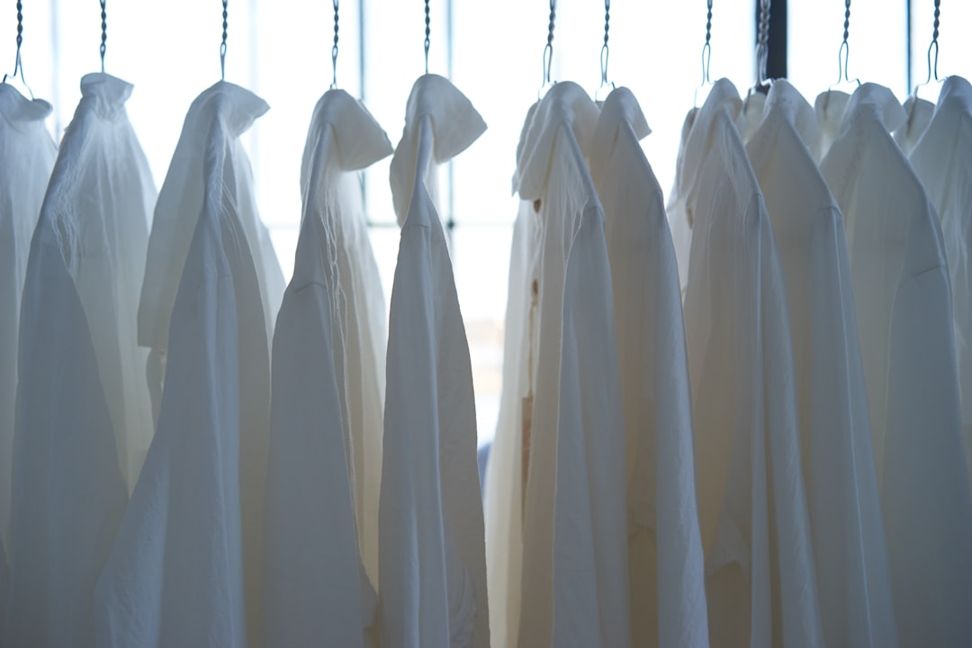 white shirts hanging neatly