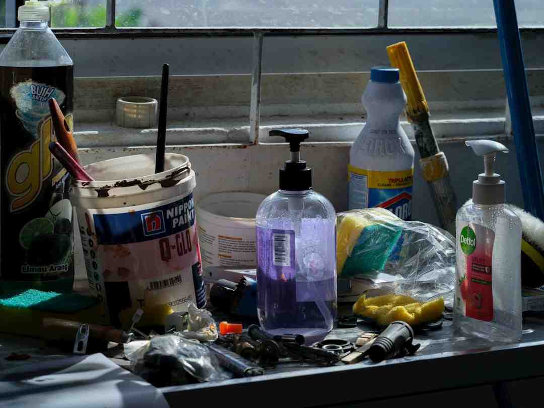 Cluttered cleaning supplies on a counter before spring cleaning