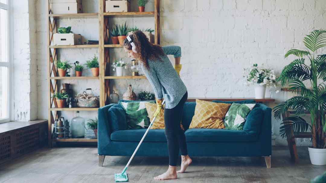 Woman cleaning the living room floor during spring cleaning