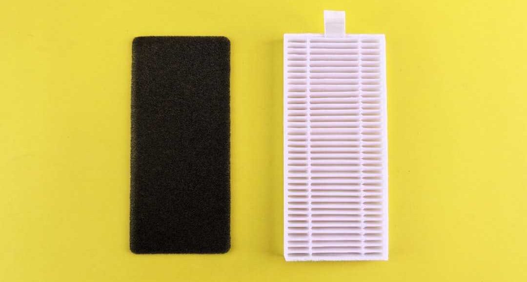 Aircon filter and dust filter placed on a yellow background