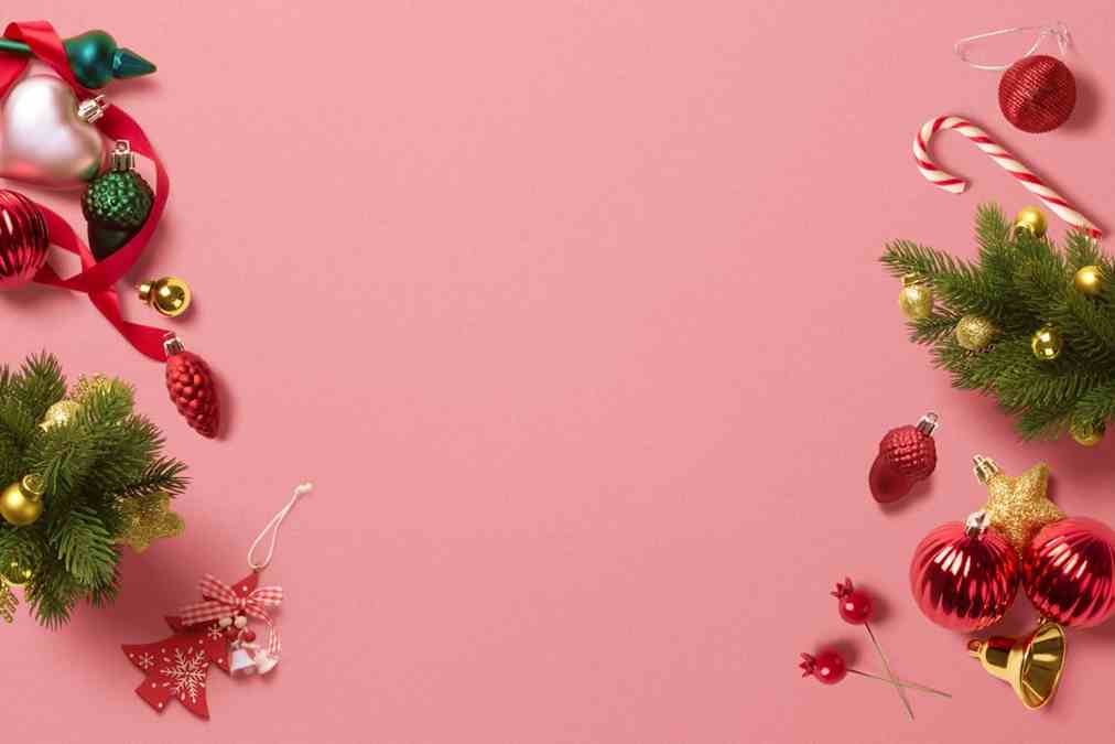 Christmas decorations on pink background